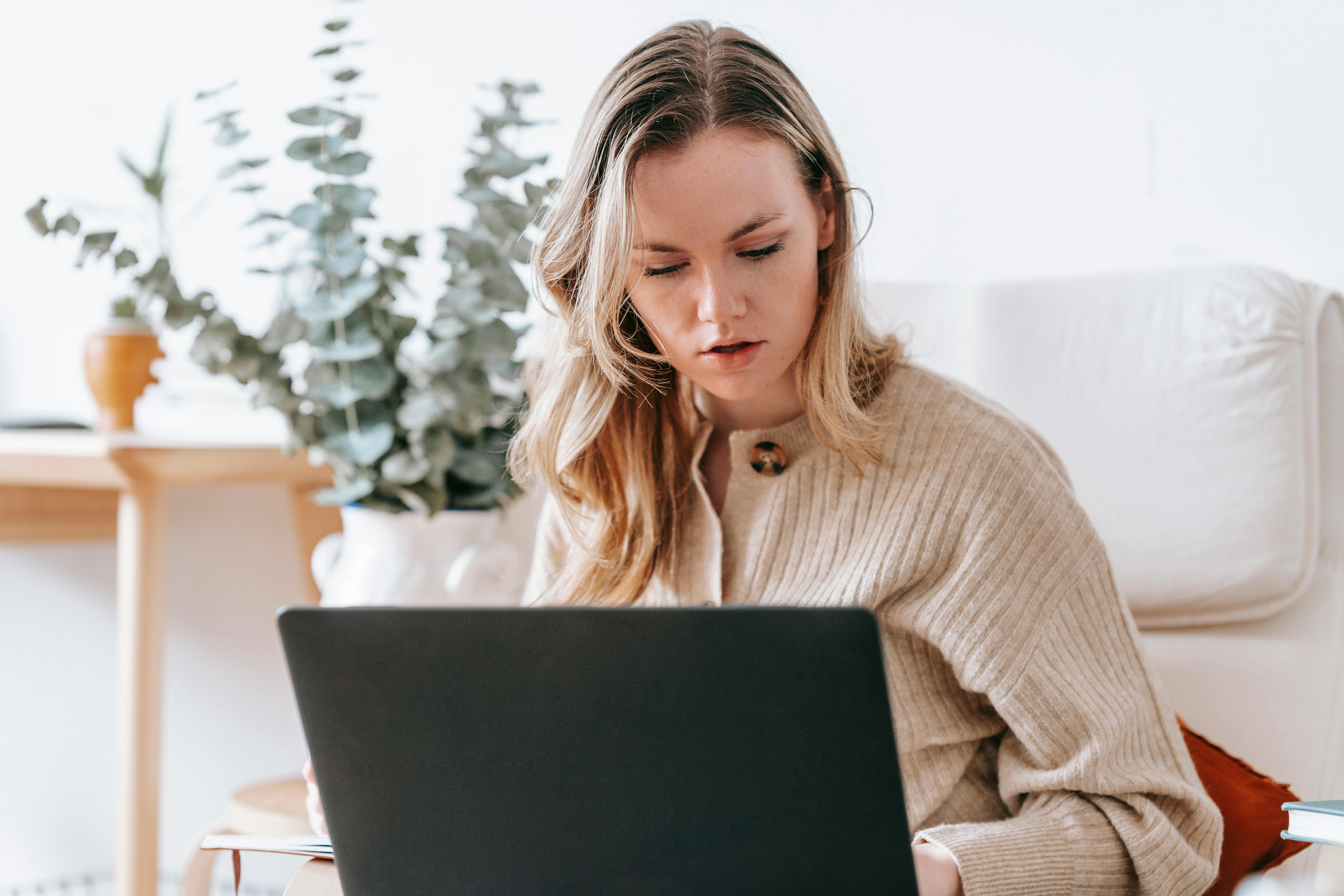 Woman studies at her laptop | Source: Pexels