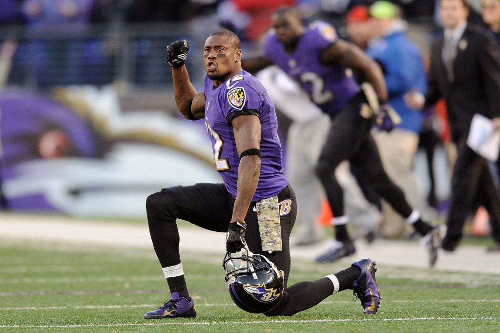 Baltimore Ravens wide receiver Jacoby Jones cheers in overtime of an NFL football game against the Cincinnati Bengals in Baltimore.